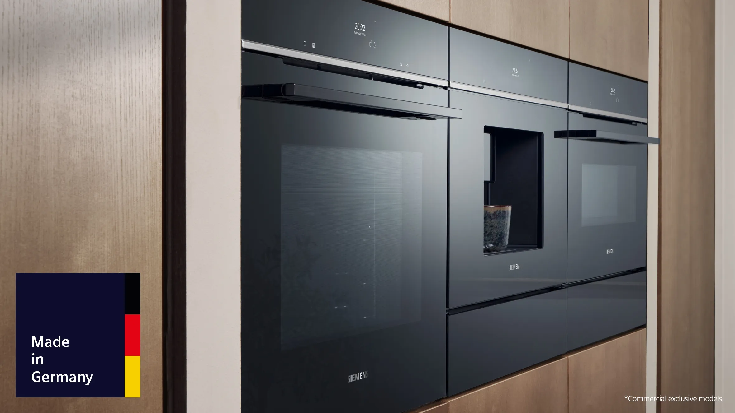  sleek, modern kitchen with built-in black Siemens iQ700 appliances, including an oven and a coffee machine, alongside wooden cabinetry