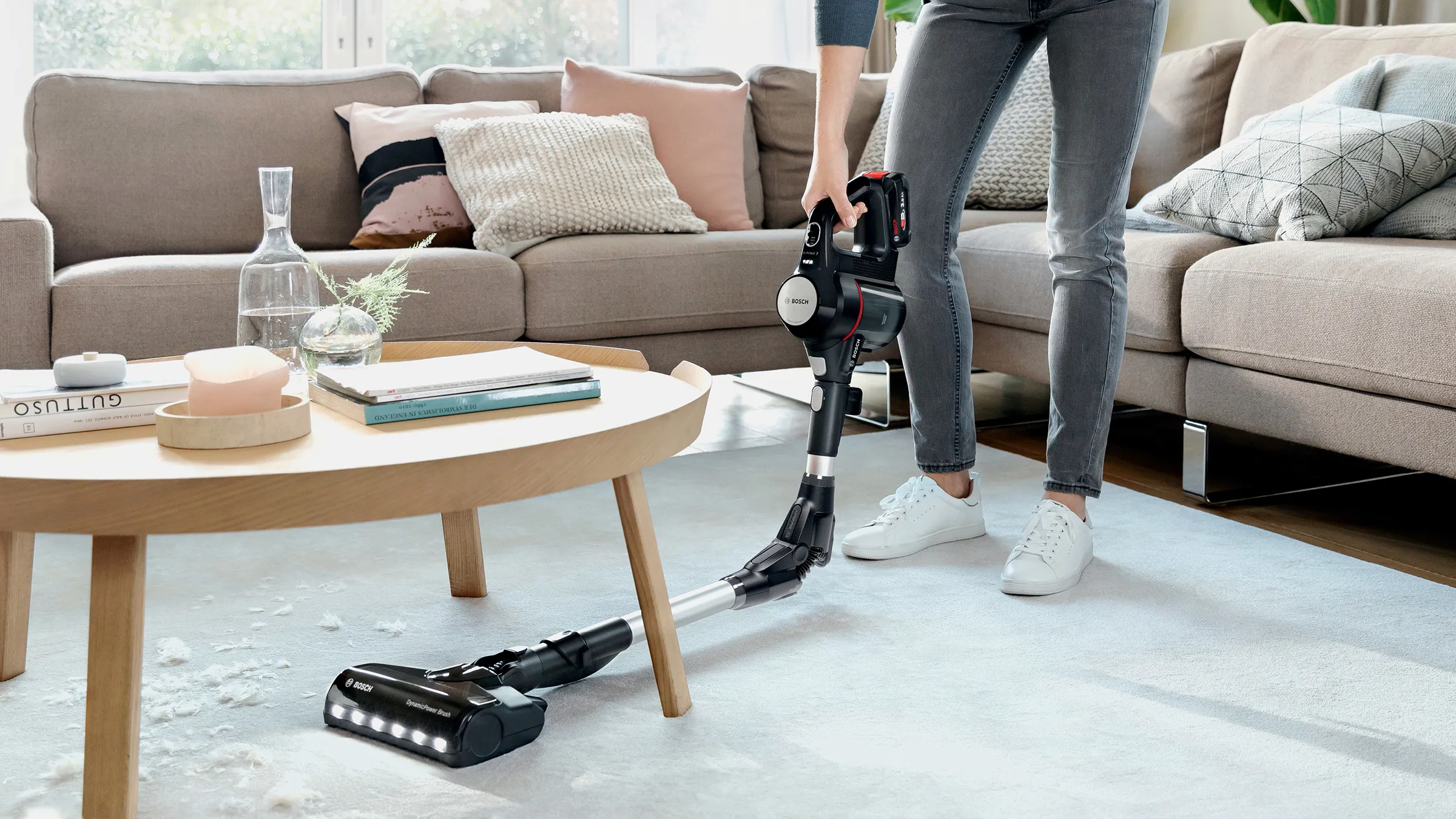 Person using flex tube on Unlimited vacuum