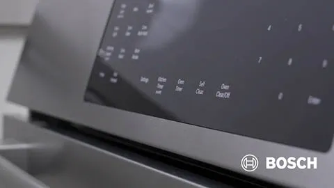 Bosch oven control panel with various settings and buttons visible.