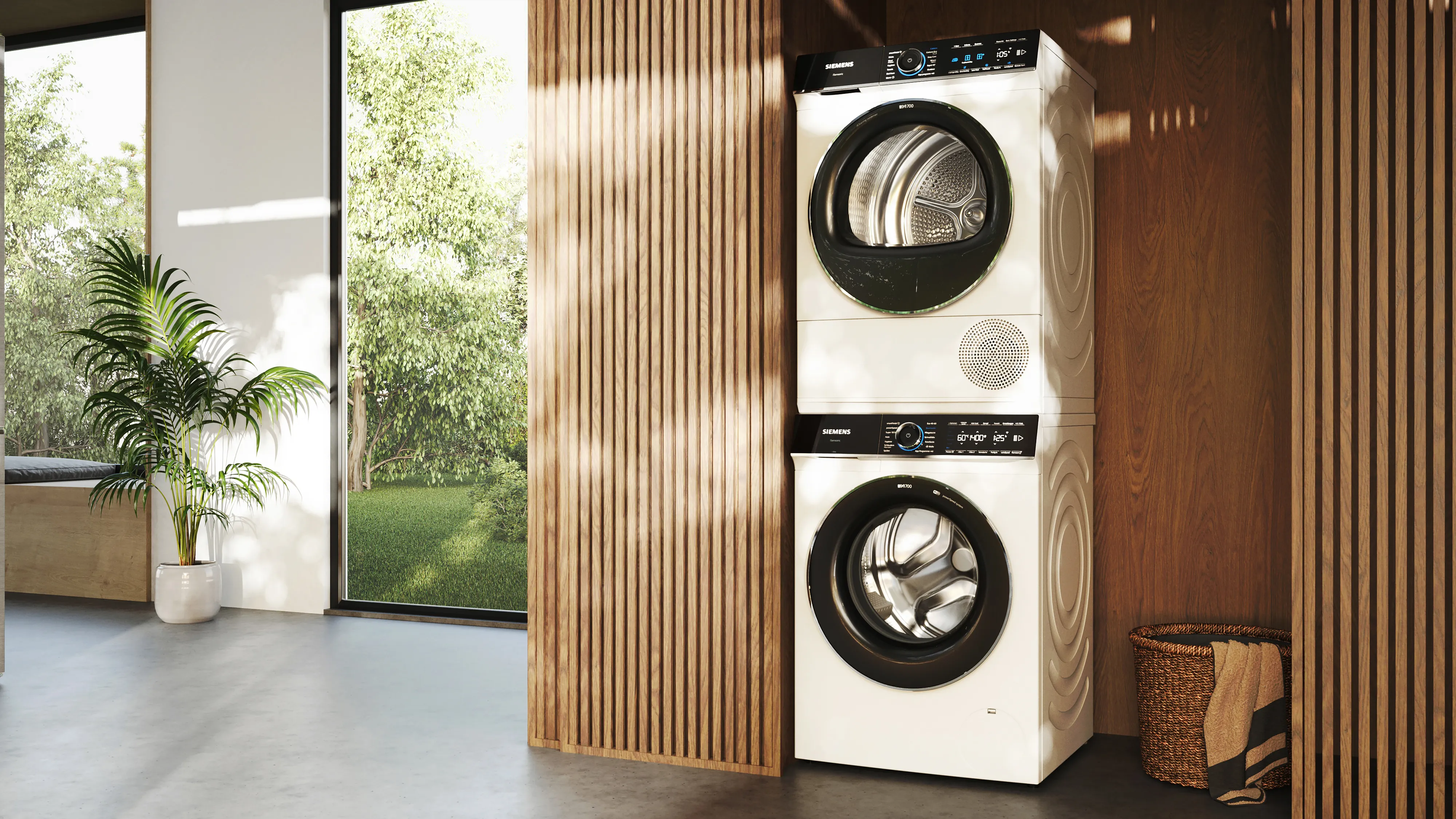 Siemens wasmachine en droger op elkaar in een houten nis met verticale latjes.