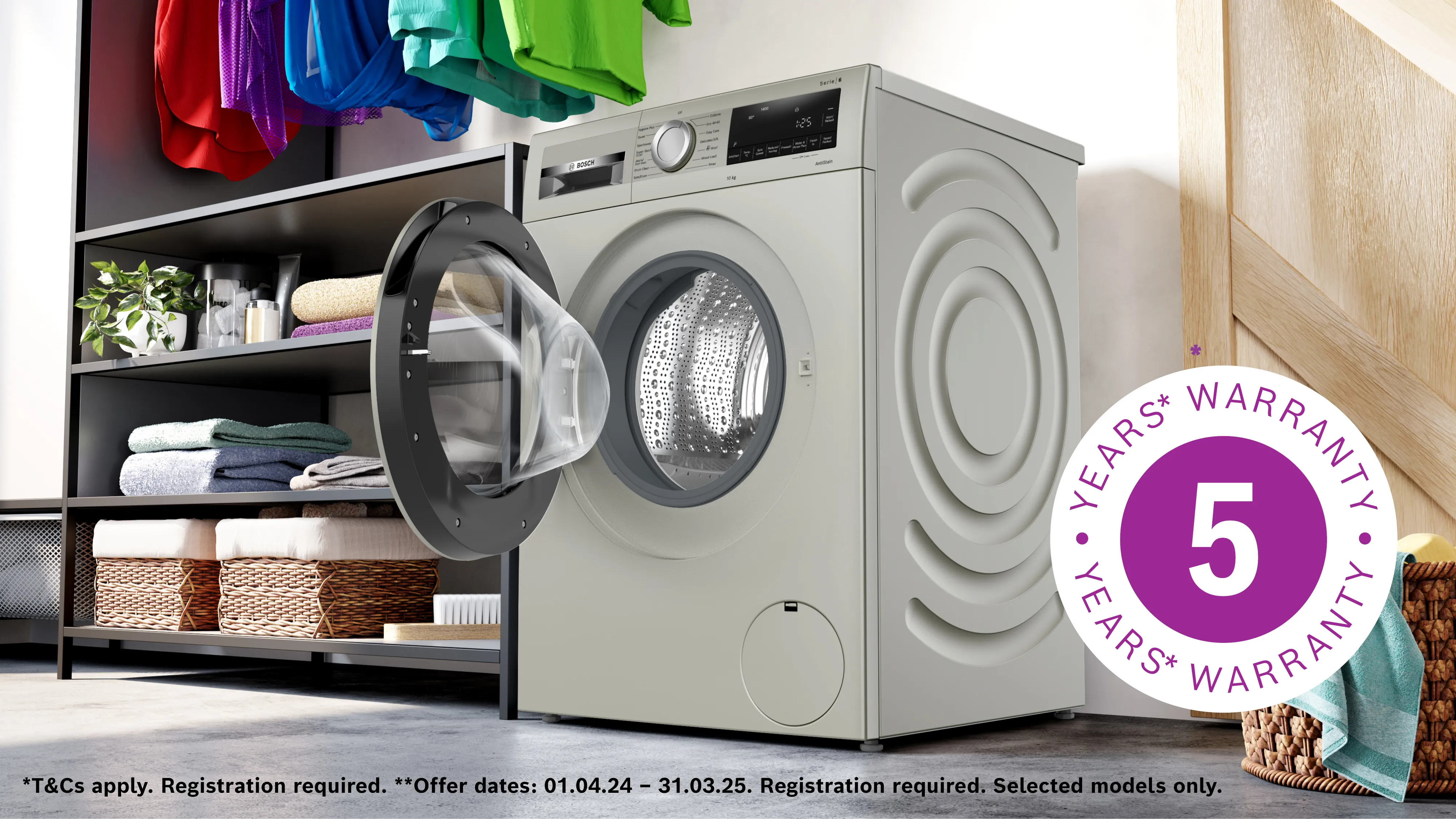 Washing machine with 5-year warranty, surrounded by shelves with folded clothes and laundry supplies.