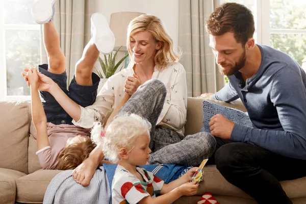 Family playing on sofa