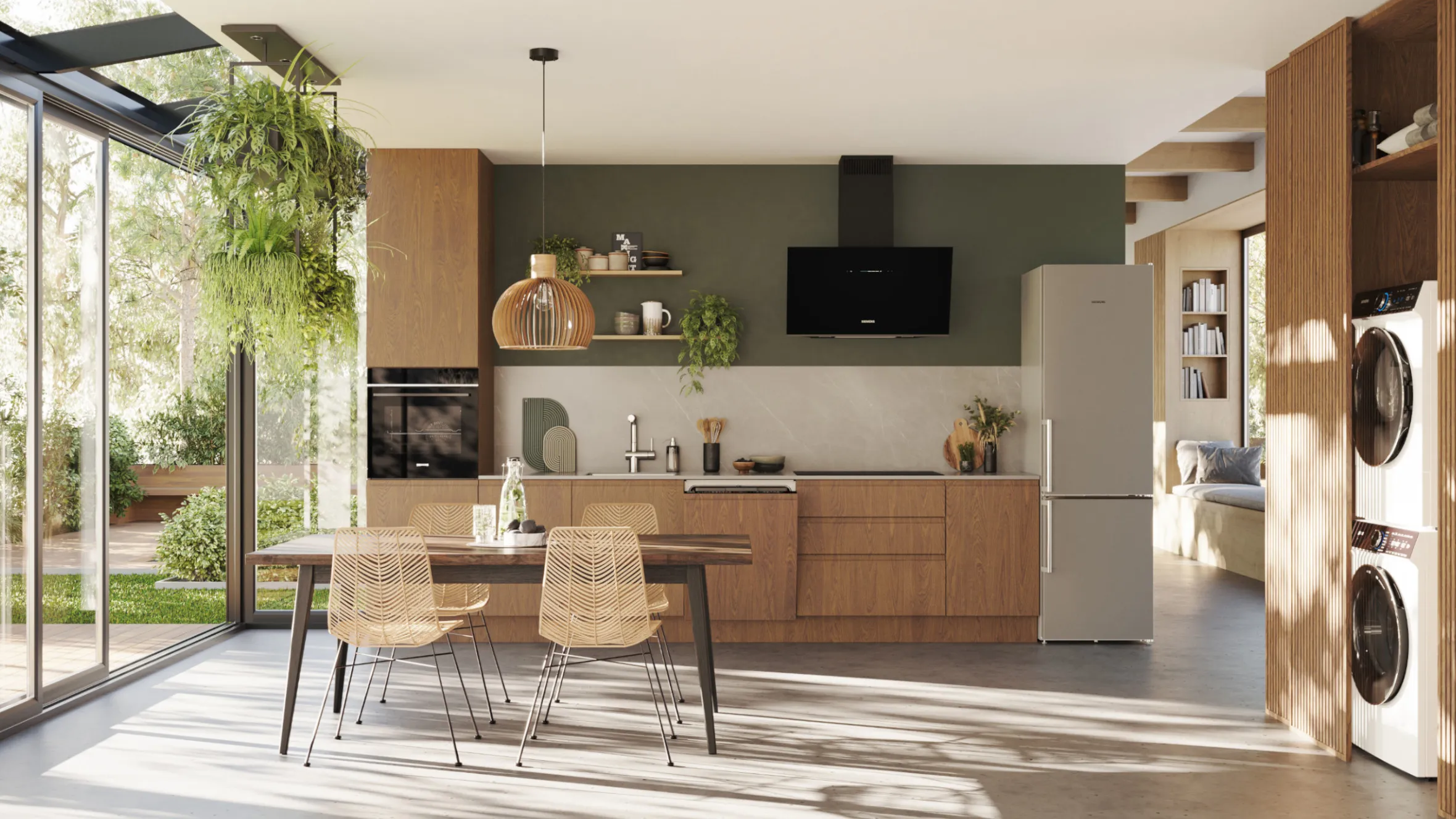 Modern kitchen with wooden cabinets, hanging plants, and large windows overlooking a garden.