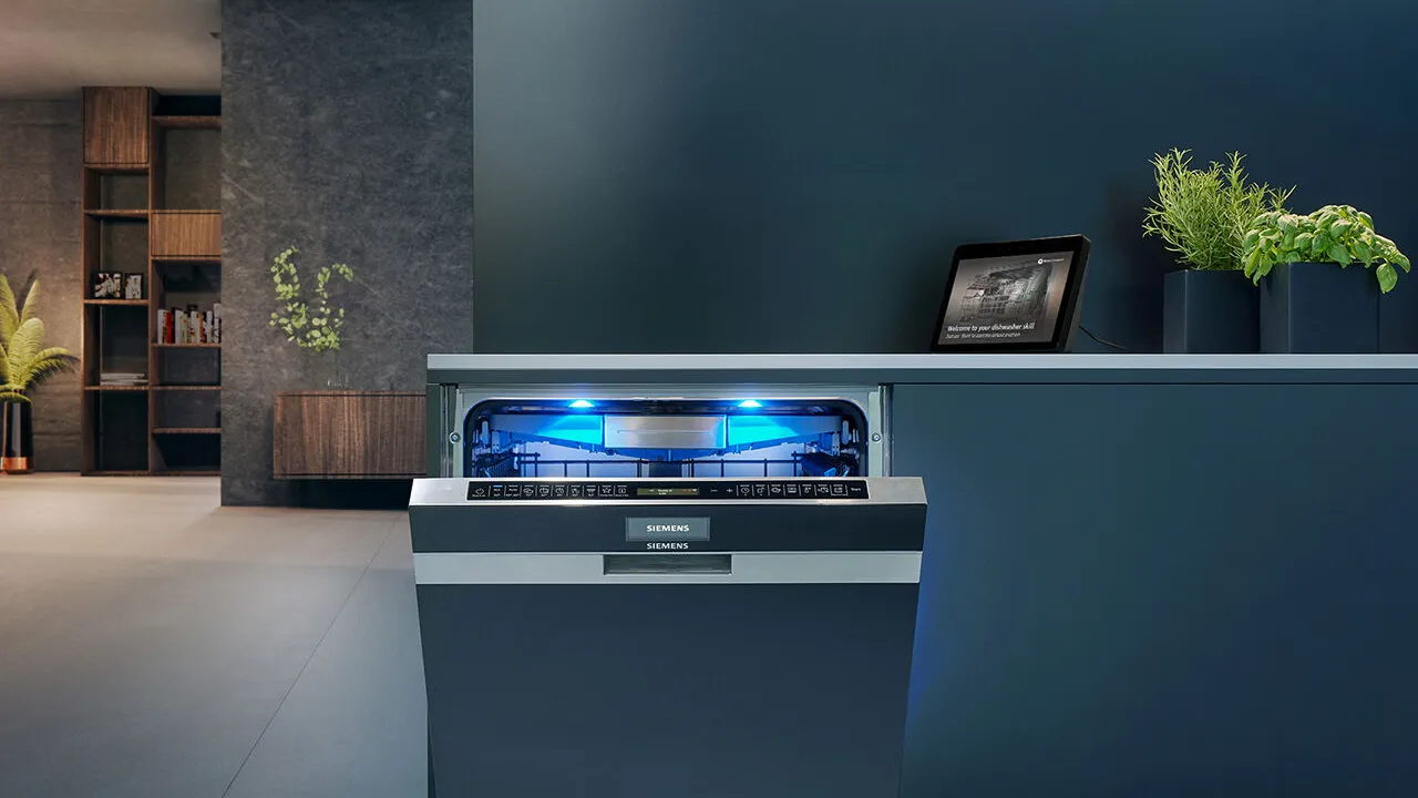 A Siemens dishwasher in the centre with a amazon echo show behind