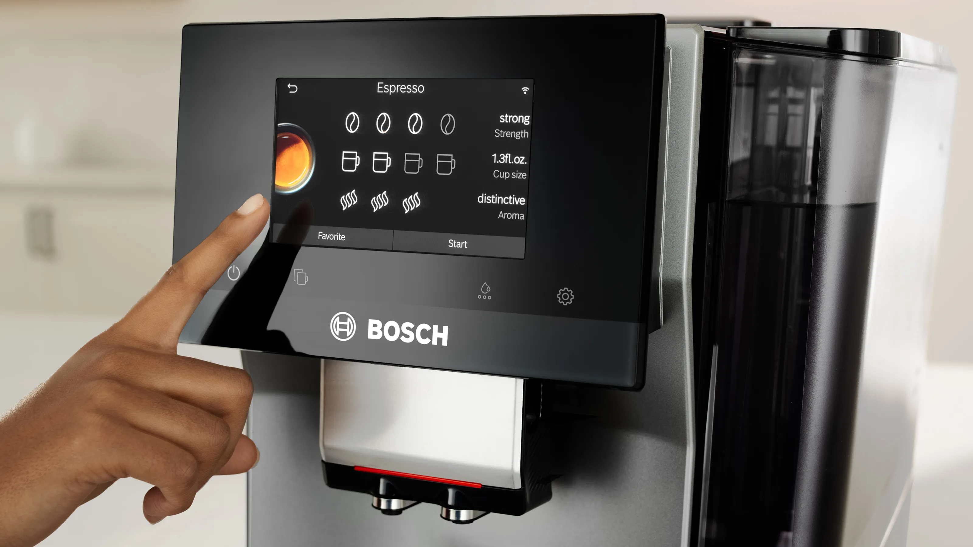 A hand touches the touchscreen interface of a Bosch coffee machine, selecting espresso options with vibrant graphics displayed.