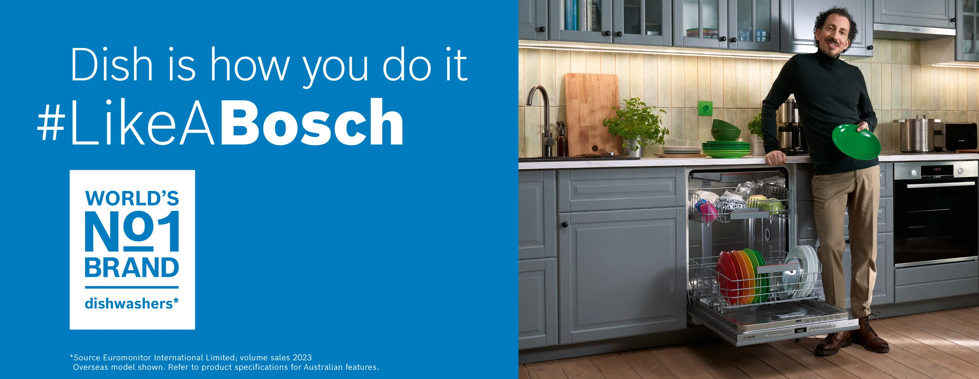 Modern kitchen featuring a sleek dishwasher, wooden countertop, and white cabinetry.