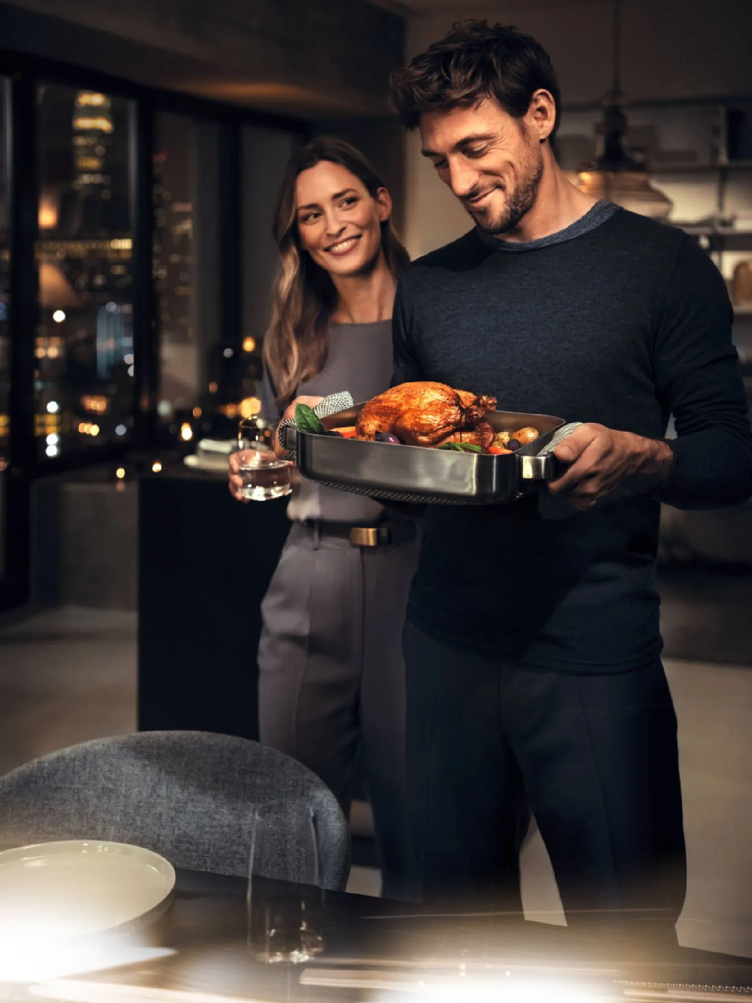 A couple setting up their dining table