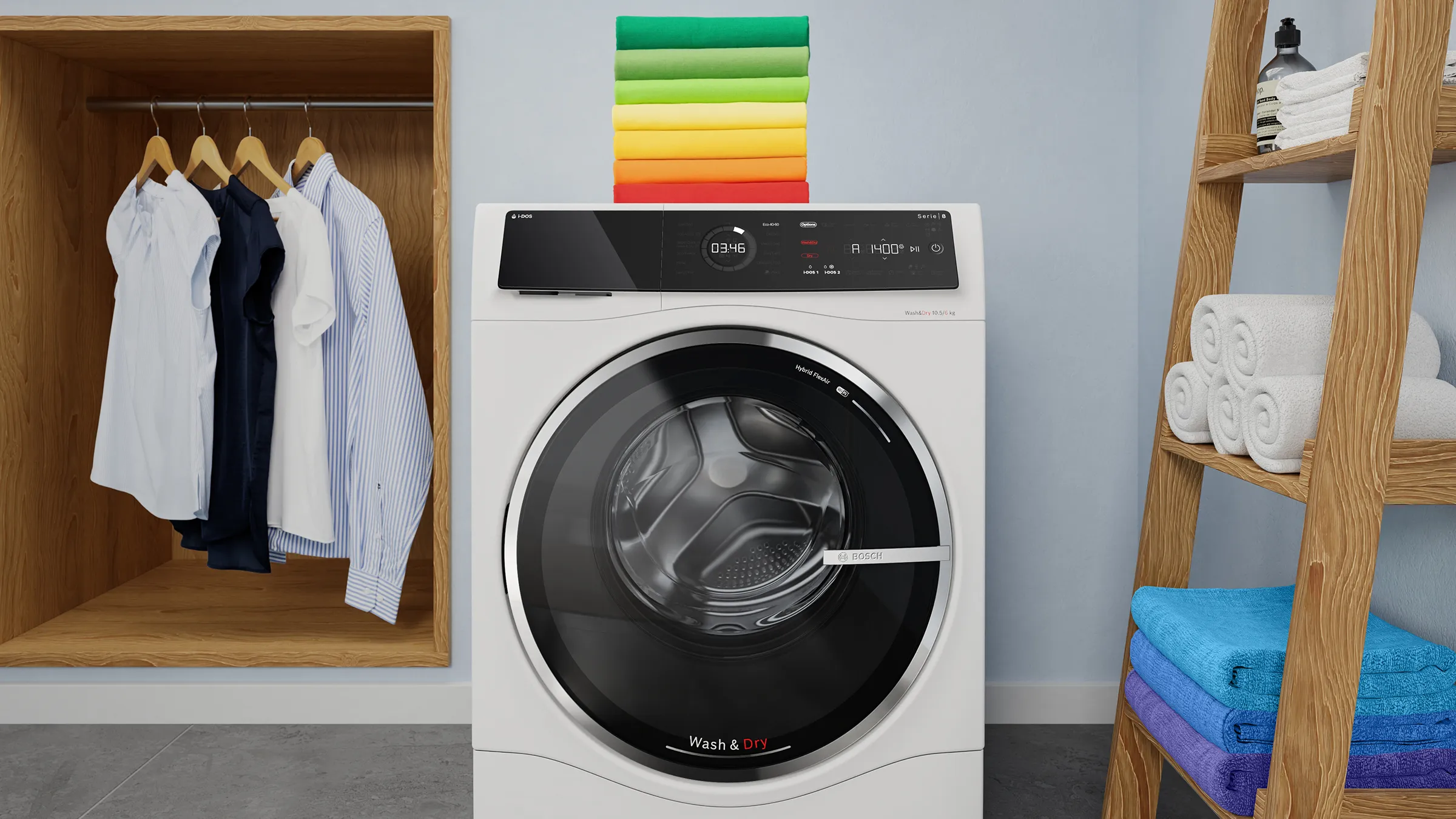 Eine weiße Bosch Wash & Dry Waschtrockner-Maschine steht in einer Waschküche. Auf der Maschine stapeln sich bunte Handtücher. Links hängen Kleidungsstücke auf Bügeln, rechts steht ein Holzregal mit Handtüchern.
