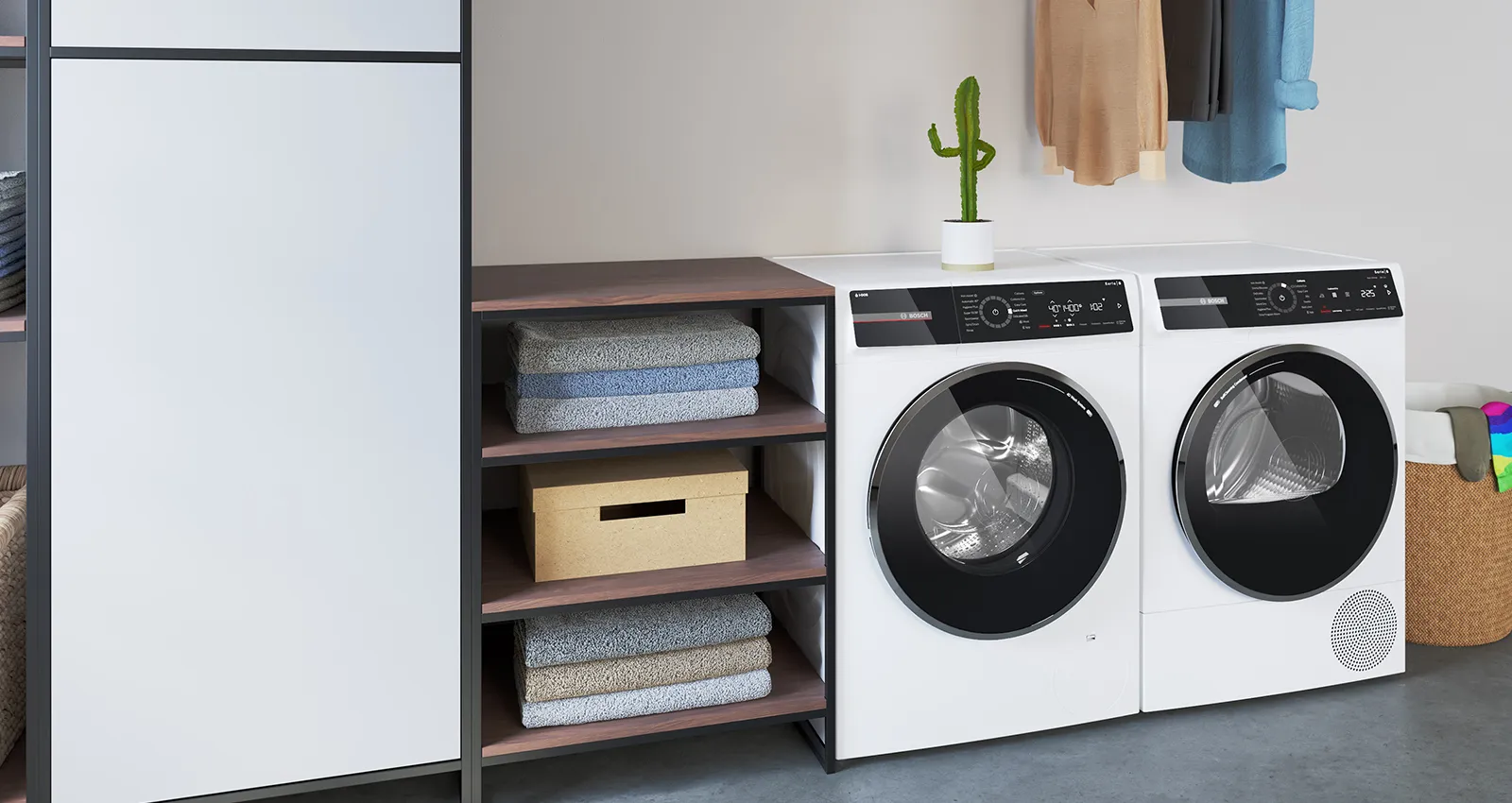 Laundry room with washing machine, dryer, shelves, and decor items.
