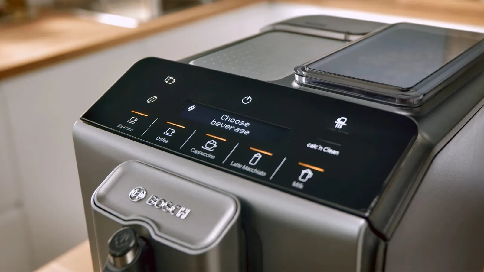 Bosch coffee machine with touch controls for selecting various beverages on display panel.