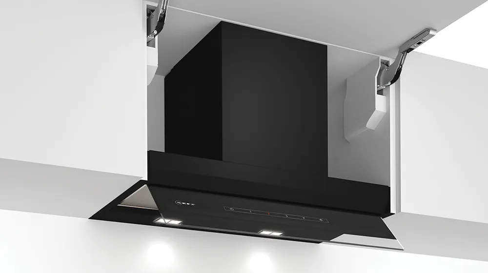 A sleek, modern kitchen hood with a white top, open mesh filter, and control panel, showcasing integrated lighting below.