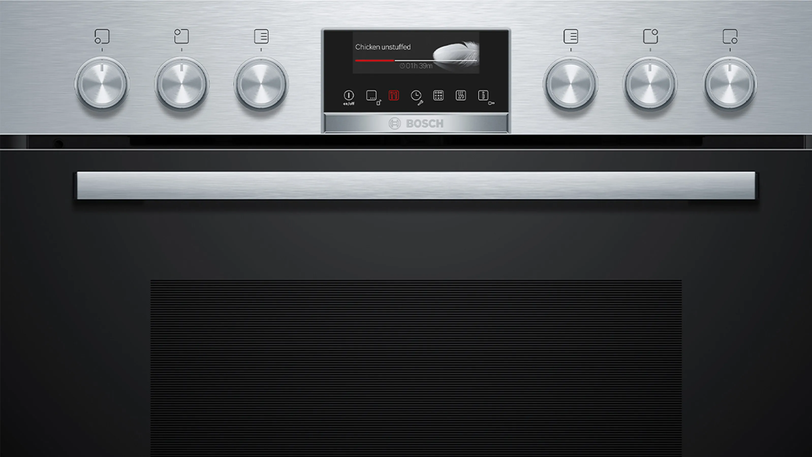 A Bosch electric hob with physical knobs for control, located together with the oven buttons.