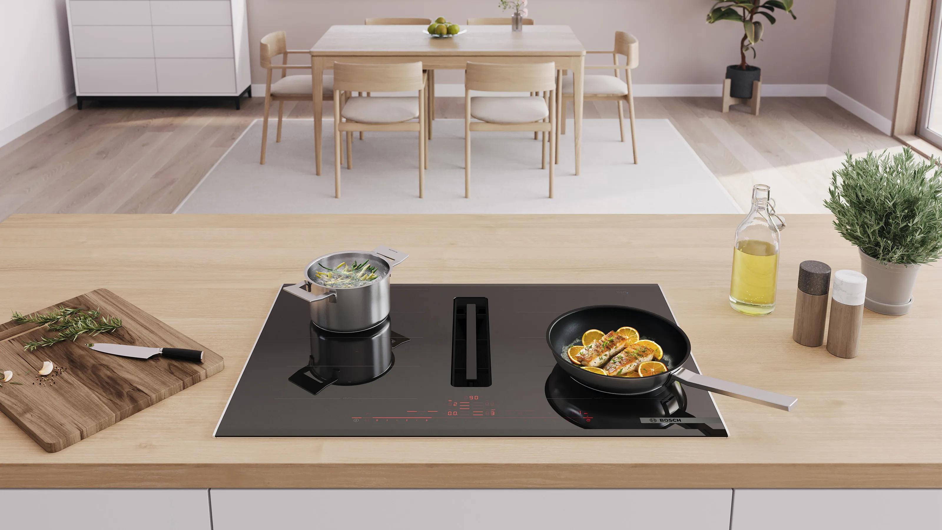 Minimalist kitchen with wooden table, cooking utensils, and plants on the counter.