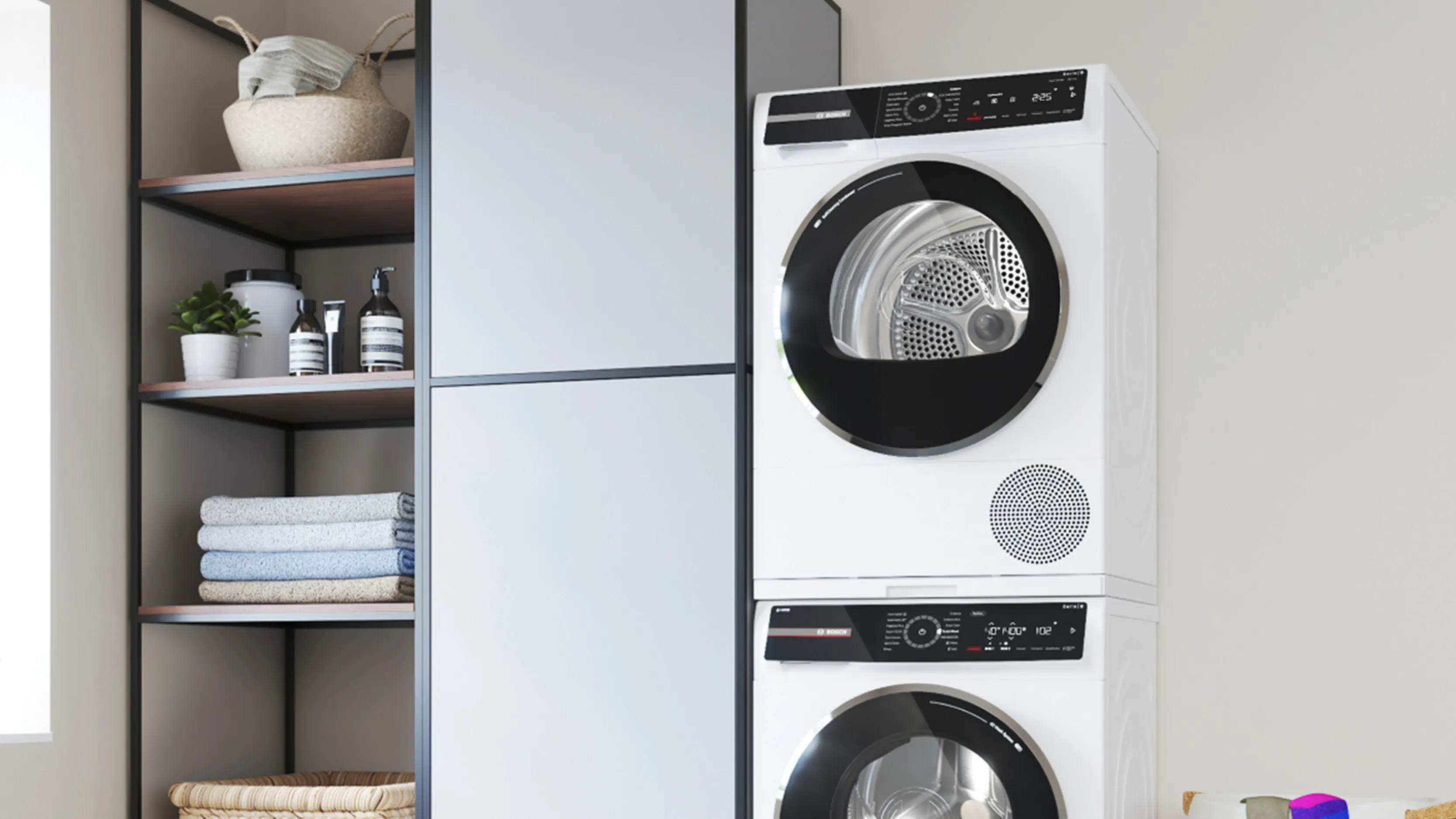 Stacked laundry appliances in clean utility room