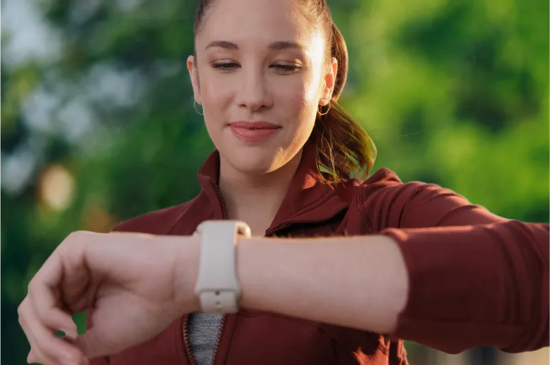 built in bottom freezer woman looking at smart watch