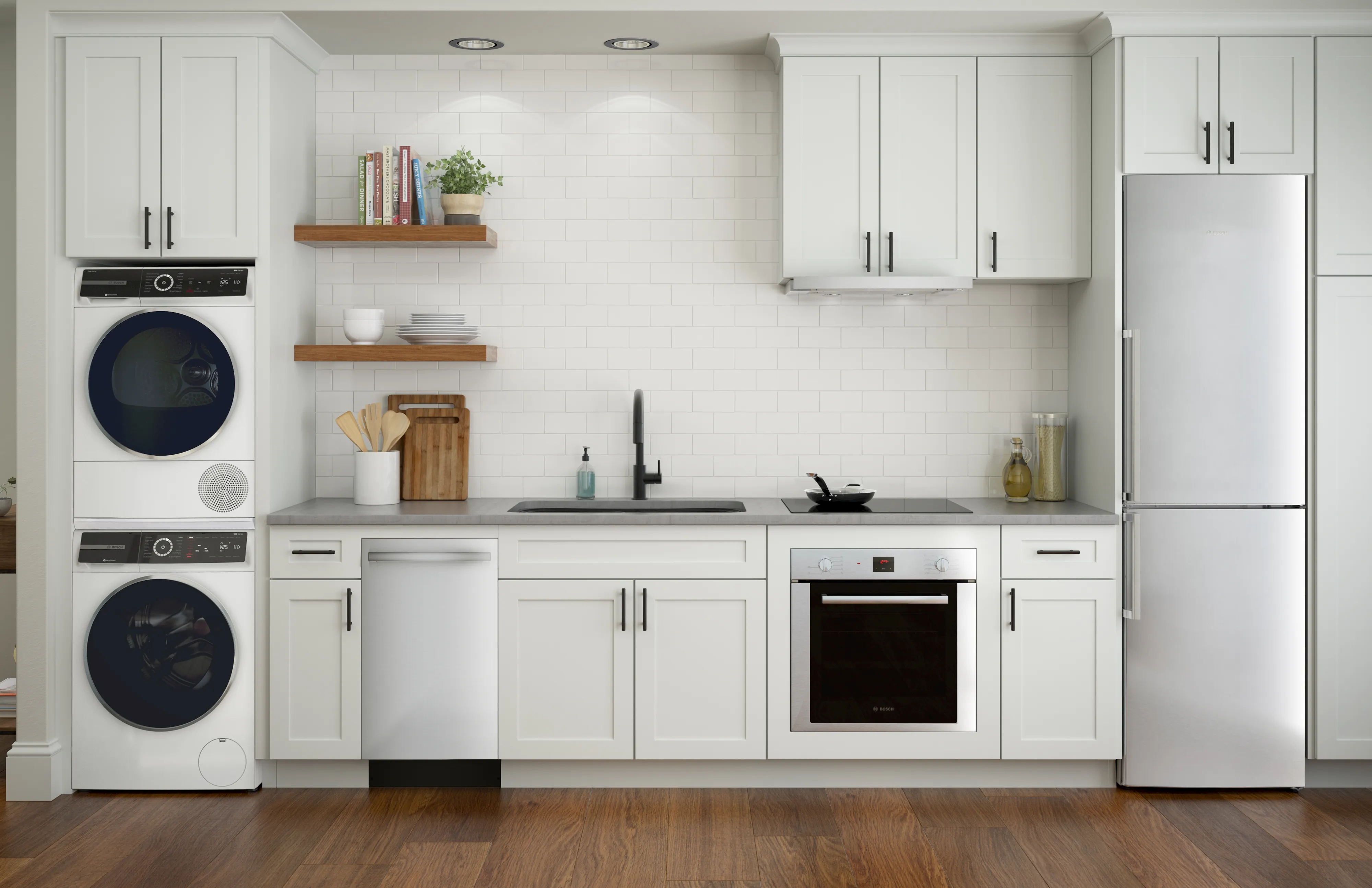 Modern kitchen with Bosch 2 door fridge, Bosch built-in oven, dishwasher, washer, dryer and island with gas cooktop under pendant lights.