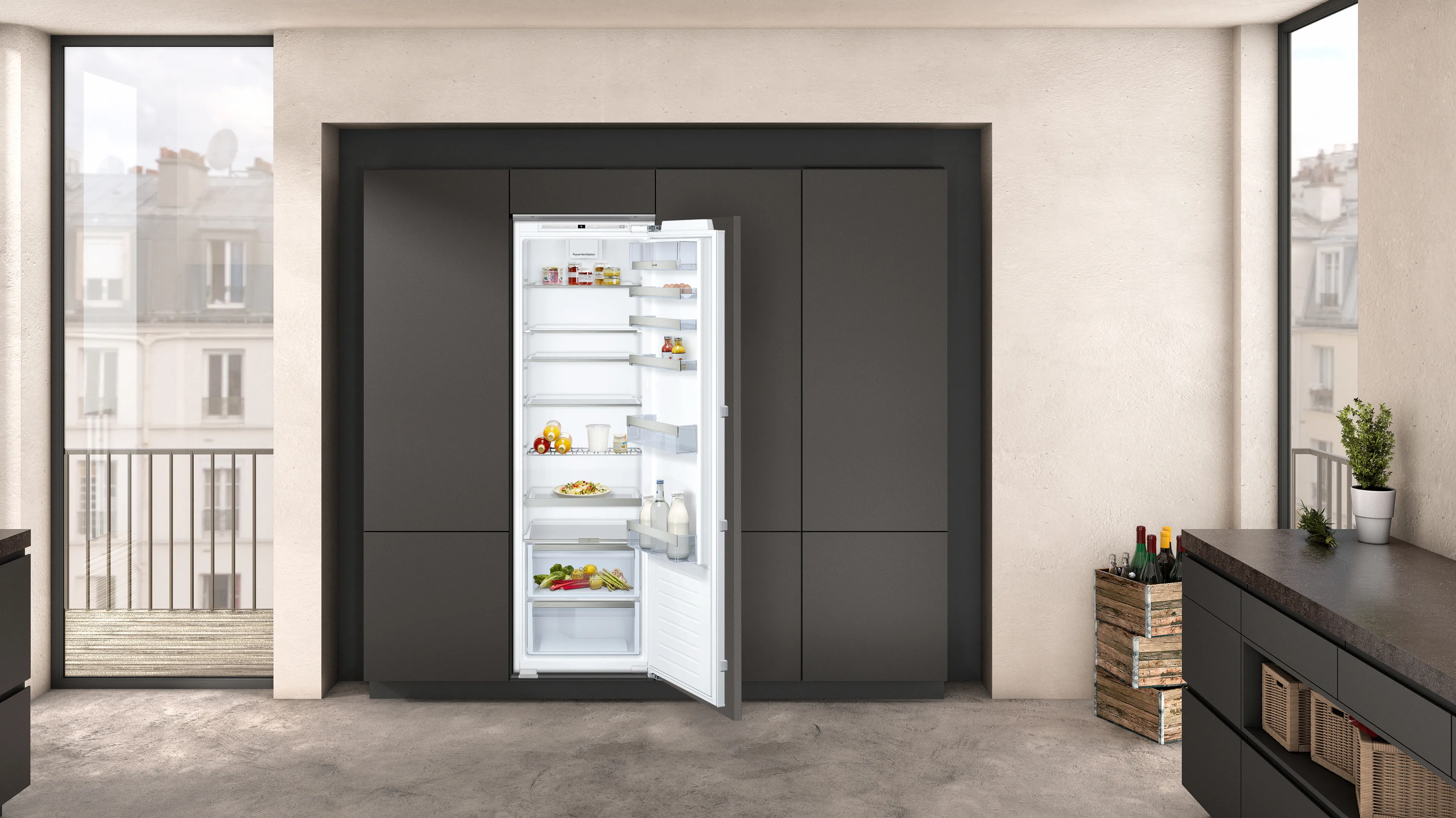 A built-in open fridge-freezer combination to the right of a large window.