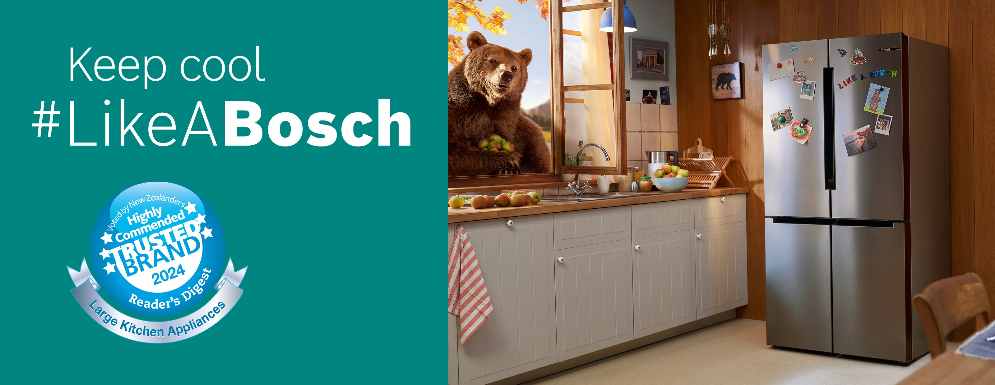 Modern kitchen with a stainless steel fridge, white cabinets, wood countertop, and blue wall decor.