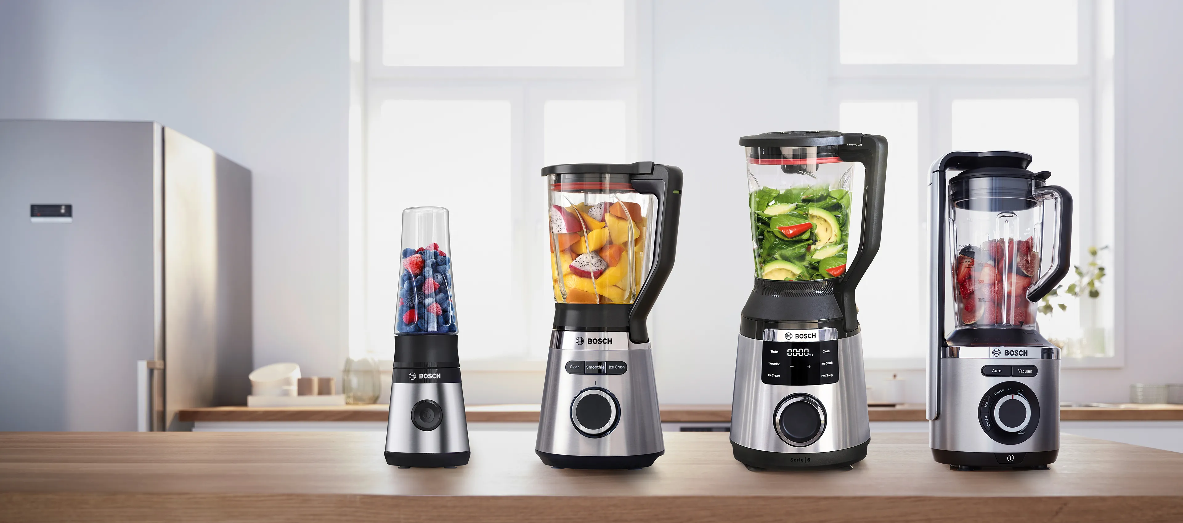 Line up of the Bosch blenders in different sizes, perfect for smoothies, soups, and more, displayed in a modern kitchen setting.