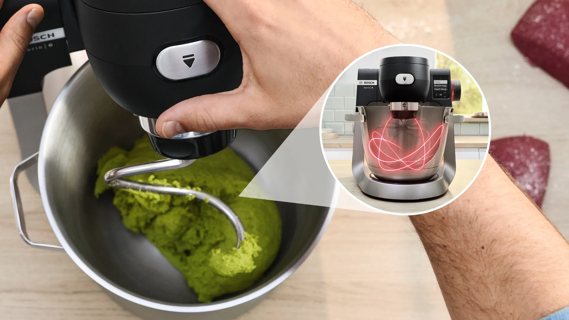 The image showcases a Bosch stand mixer in action, with a hand gripping the mixer head as it blends a vibrant green dough inside the stainless steel bowl. The dough appears well-mixed and has a smooth texture. An inset reveals a digital representation of the mixer, demonstrating its mixing process with animated red lines, illustrating the motion and effectiveness of the mixing action. This visual highlights the mixer’s advanced capabilities, designed to handle a variety of batter and doughs efficiently. It emphasizes the user-friendly design and functionality of the Bosch mixer.