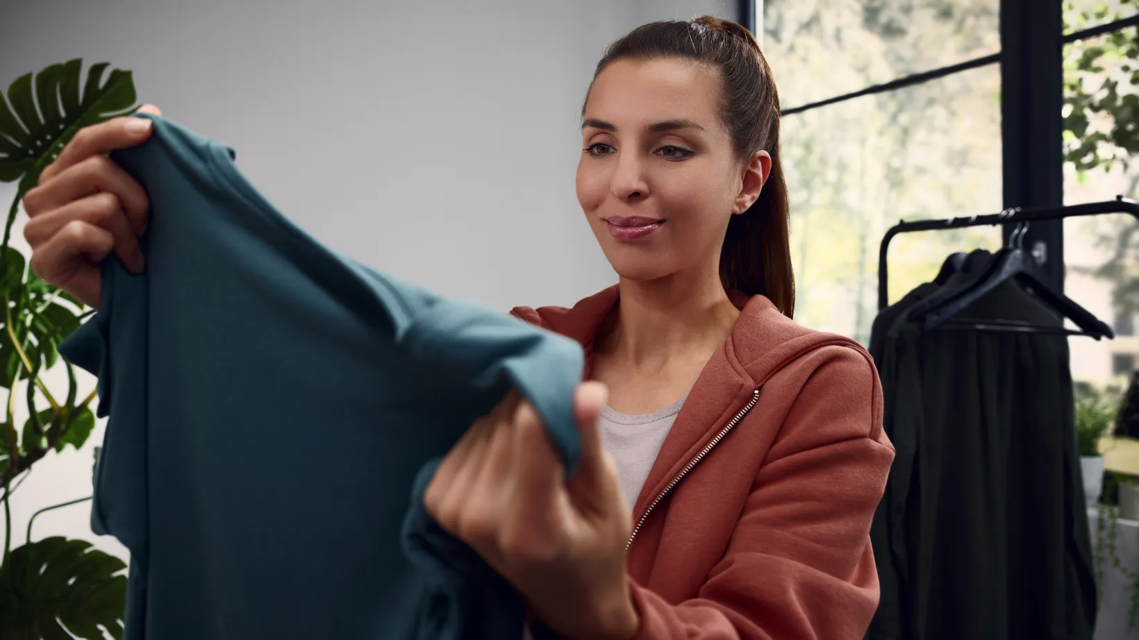 Woman looking at shirt