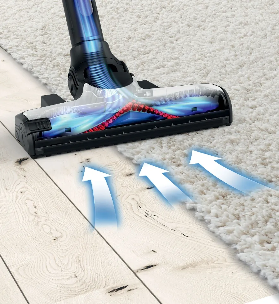 A close-up of a Bosch vacuum cleaner head transitioning from a wooden floor to a white shag rug, with blue arrows illustrating powerful suction and airflow.
