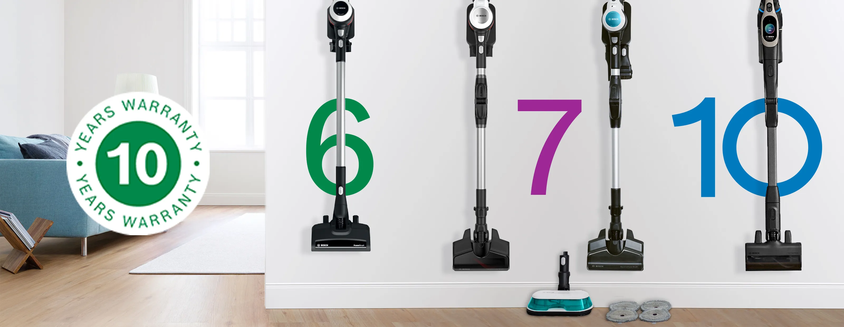 Two sleek stick vacuums hang on a light wall, adjacent to a stylish sofa, decorative plant, and a modern coffee table.