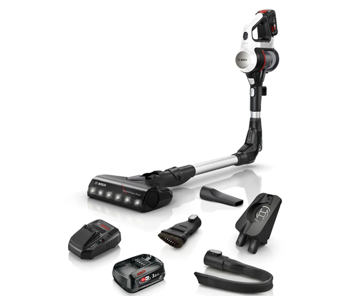 Cordless vacuum cleaner with various attachments and accessories, including a battery charger.