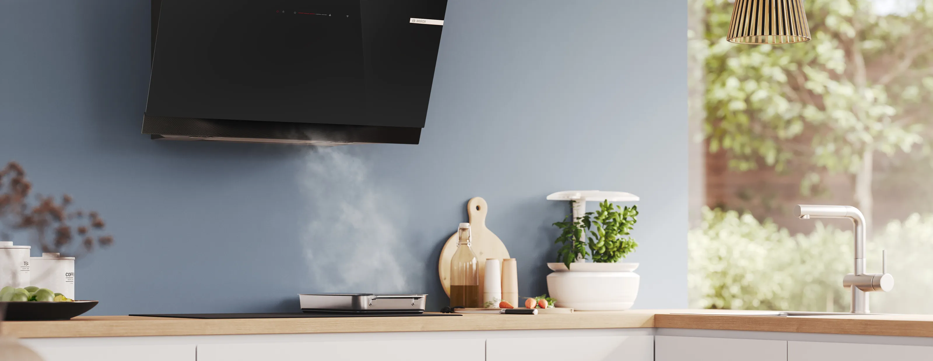 Modern kitchen with a stovetop releasing steam, wooden countertop, herb planter, cutting board, and a sleek faucet near a window.