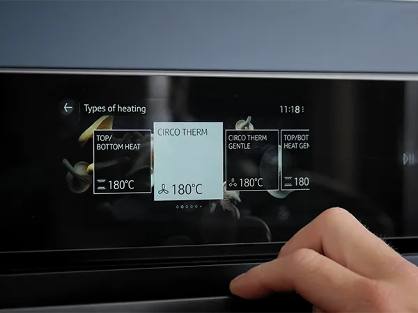 Digital display showing temperature, time, and other information on a dark background.