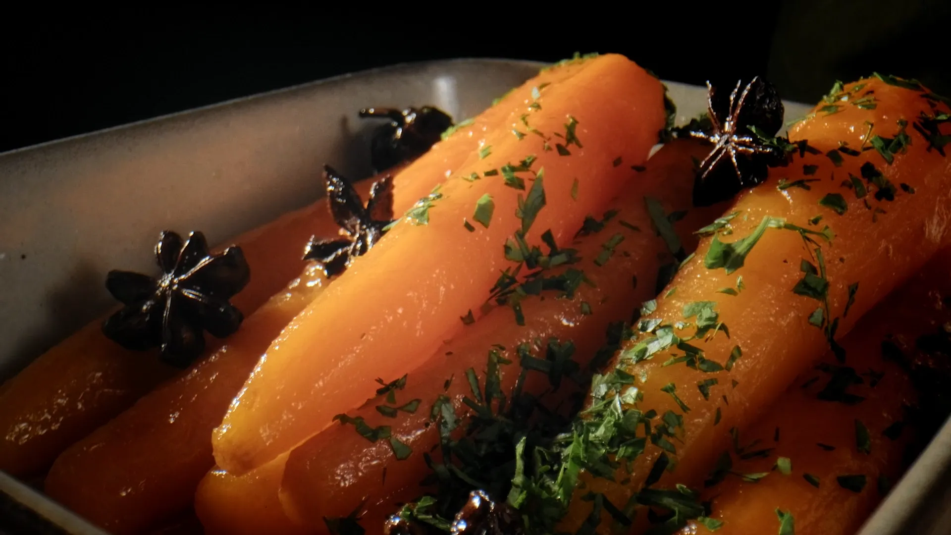Star anise glazed carrots in roasting dish