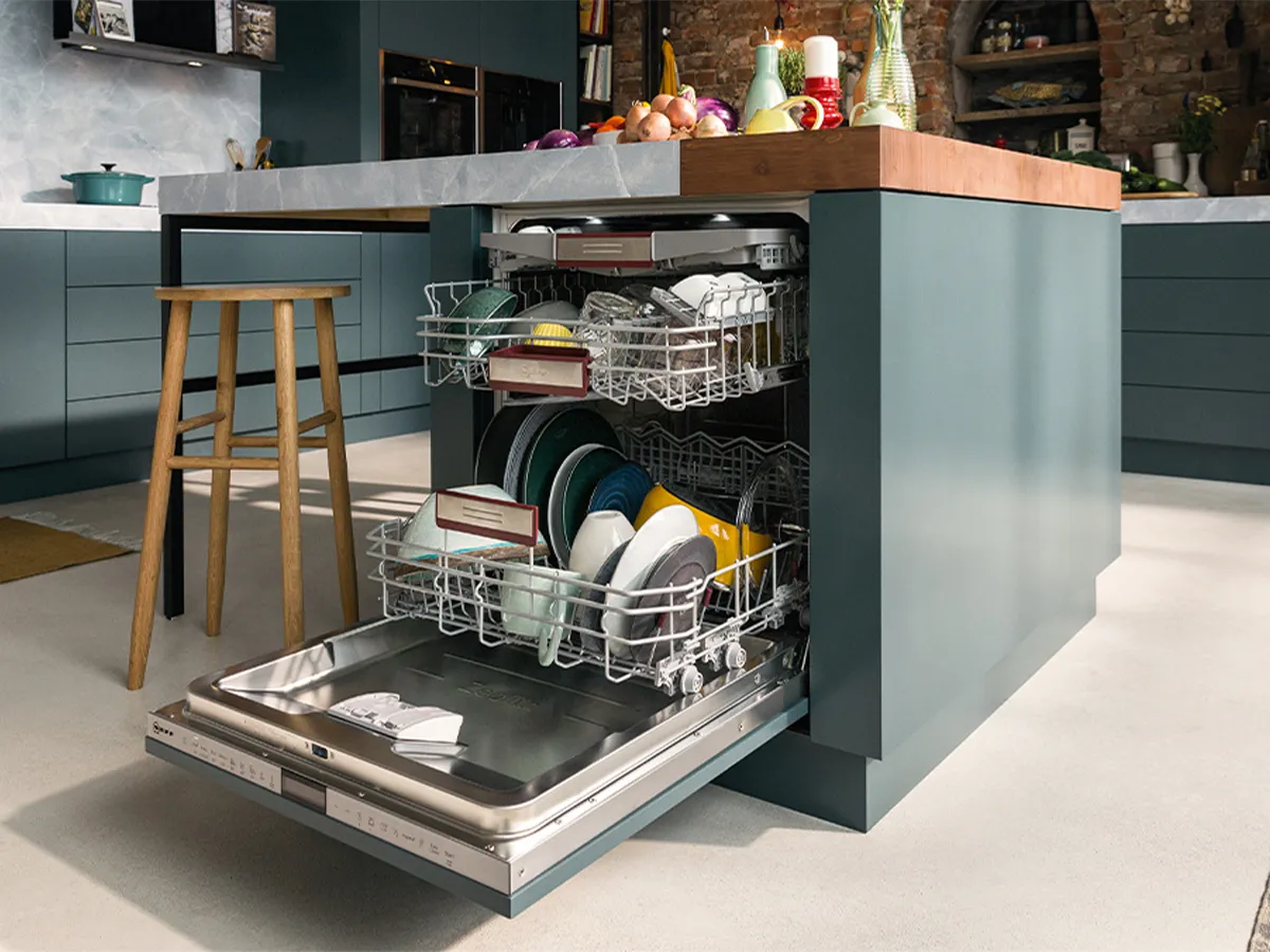 Open dishwasher underneath kitchen counter