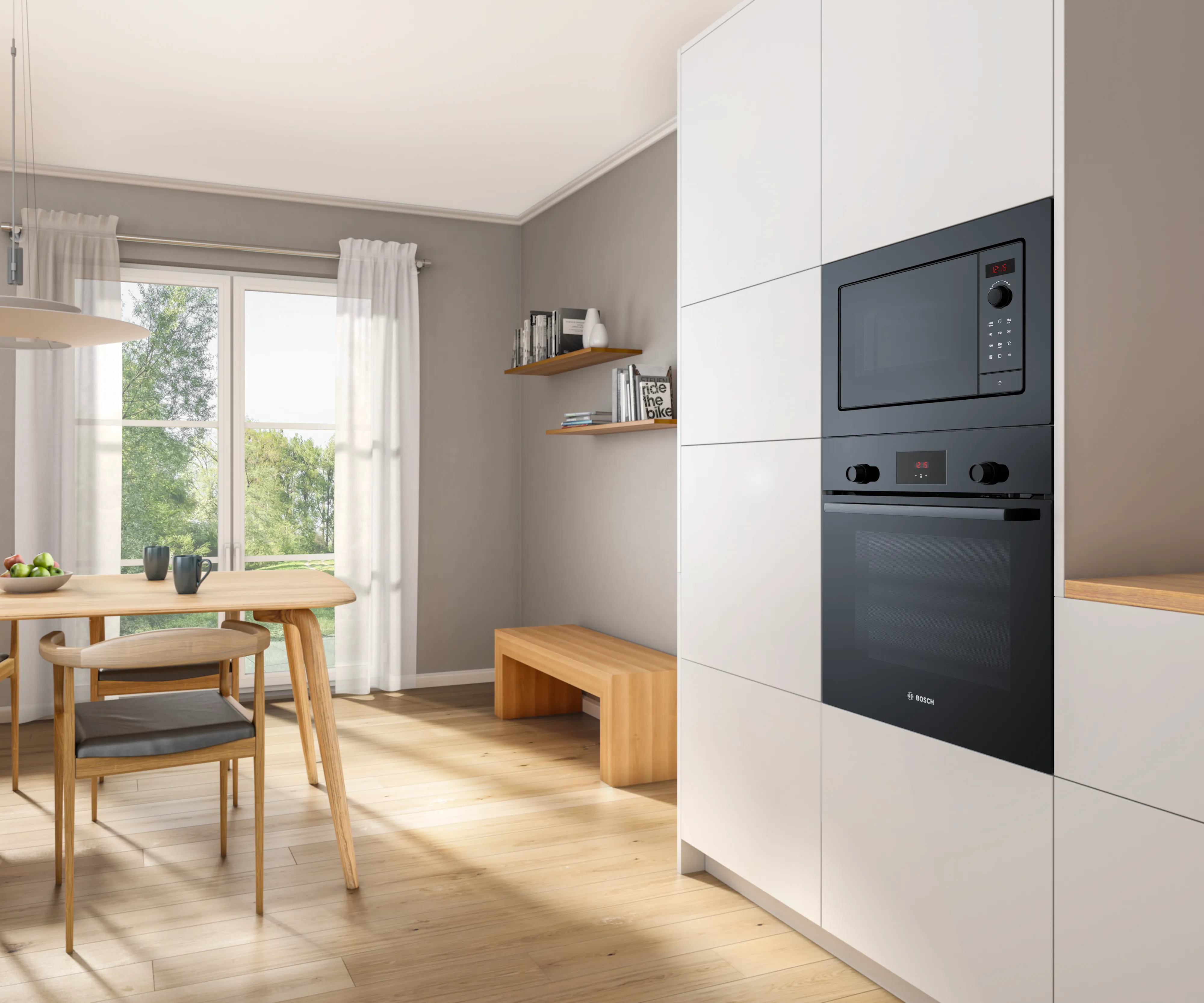 Black built-in Bosch microwave, atop a Bosch oven, seamlessly combining within a white kitchen cabinet.