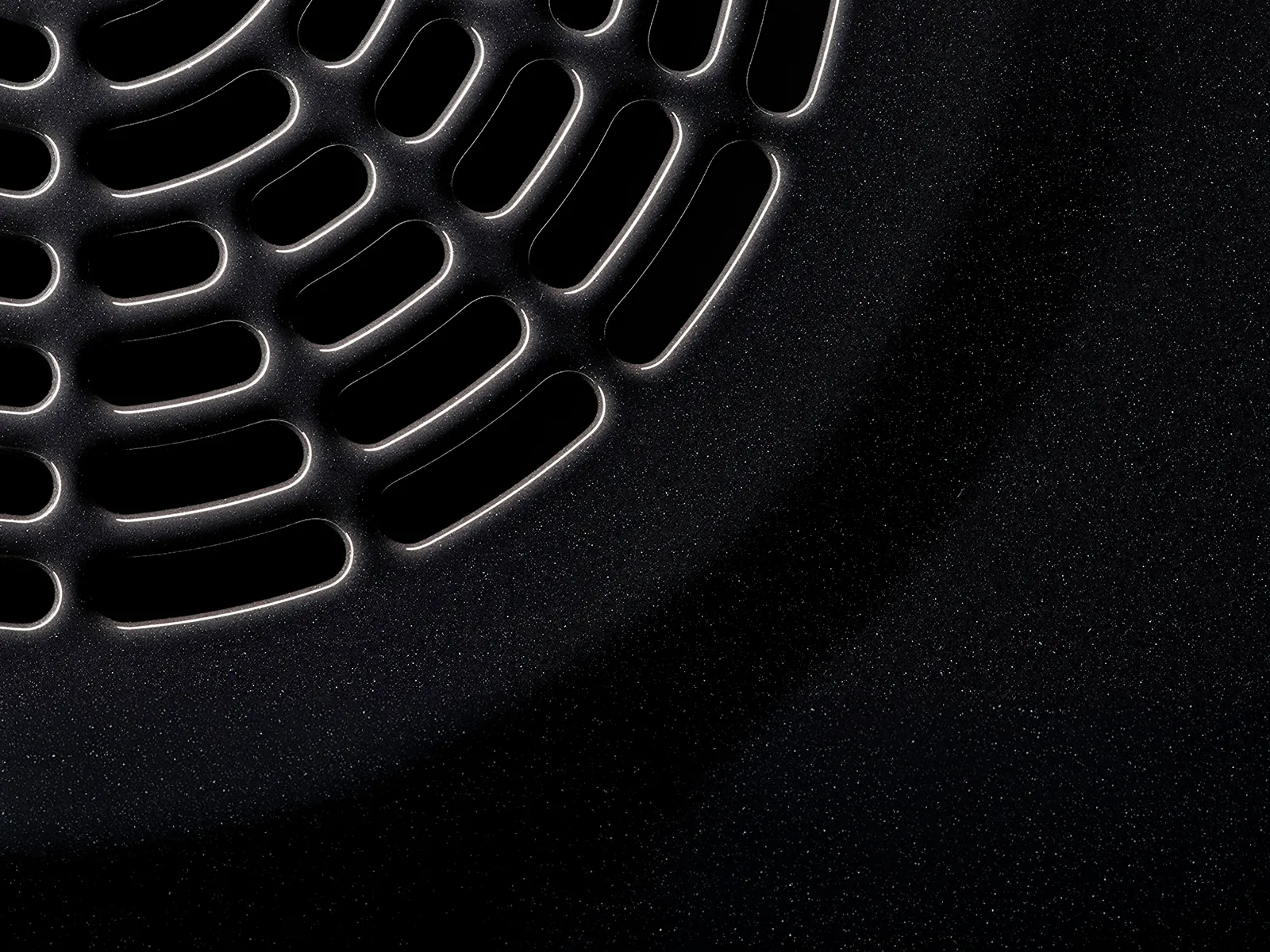 Bosch black surface with a elongated holes and bright edges.