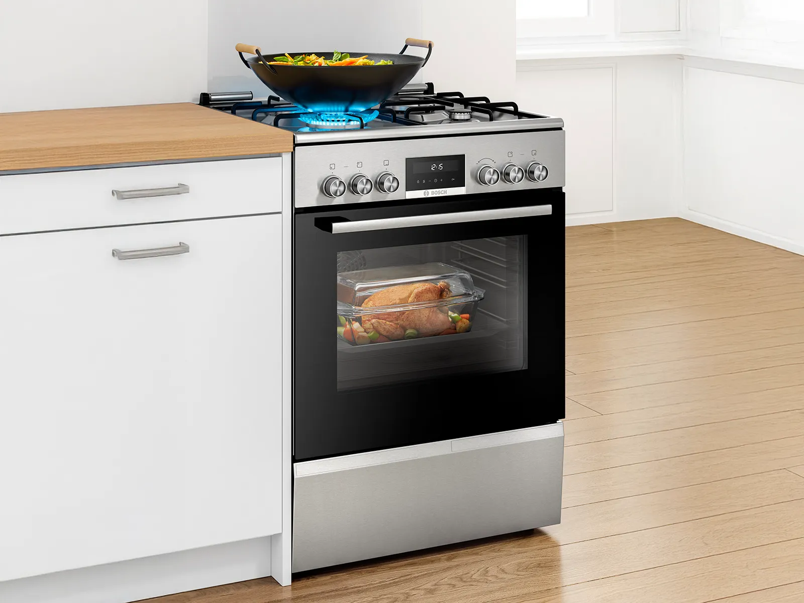 Bosch freestanding cooker with a gas hob cooking a wok dish and oven roasting chicken, combining versatility and style.