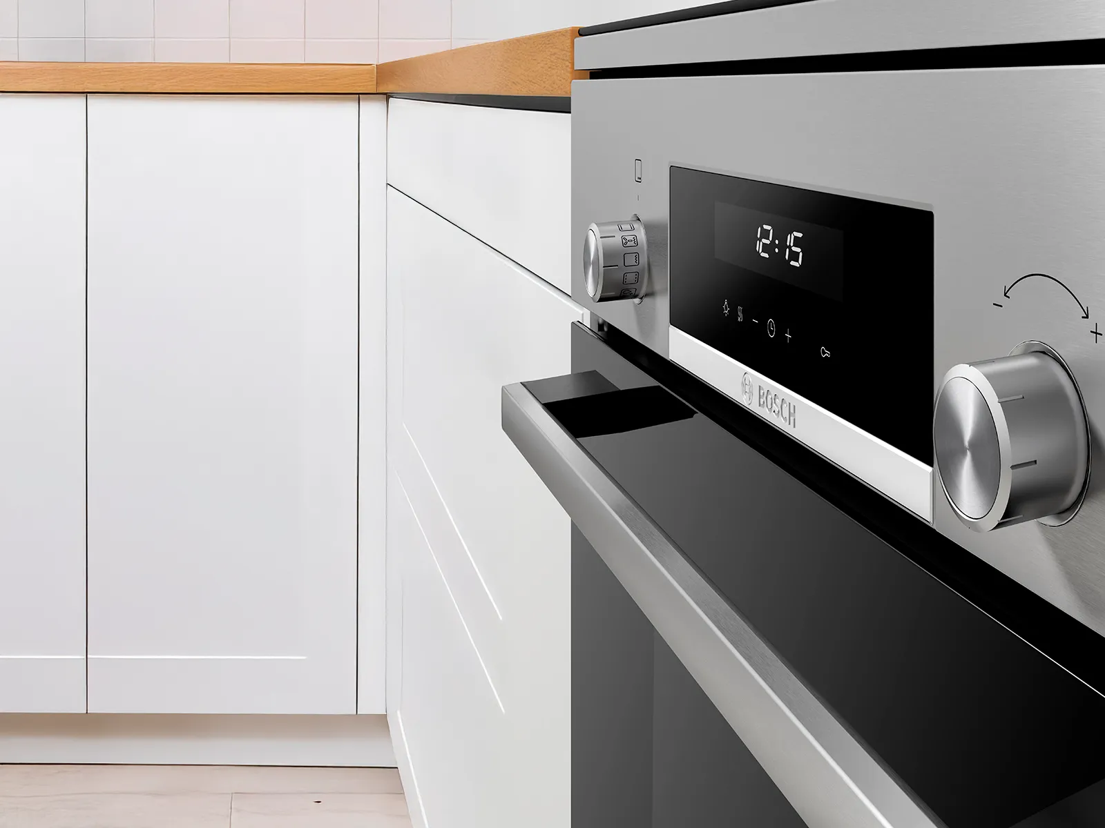 Close-up of Bosch freestanding cooker with digital display and precision knobs, highlighting easy-to-use controls.