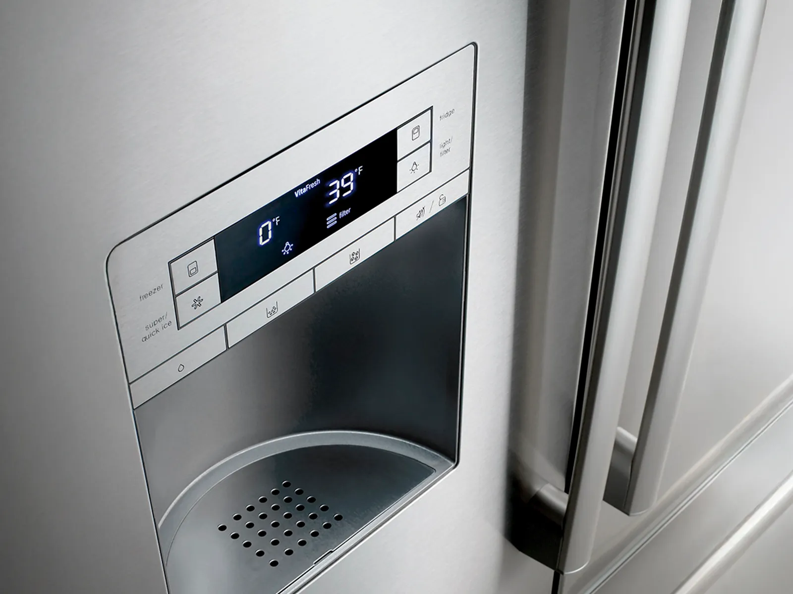 Stainless steel refrigerator water dispenser and ice maker with digital temperature display.