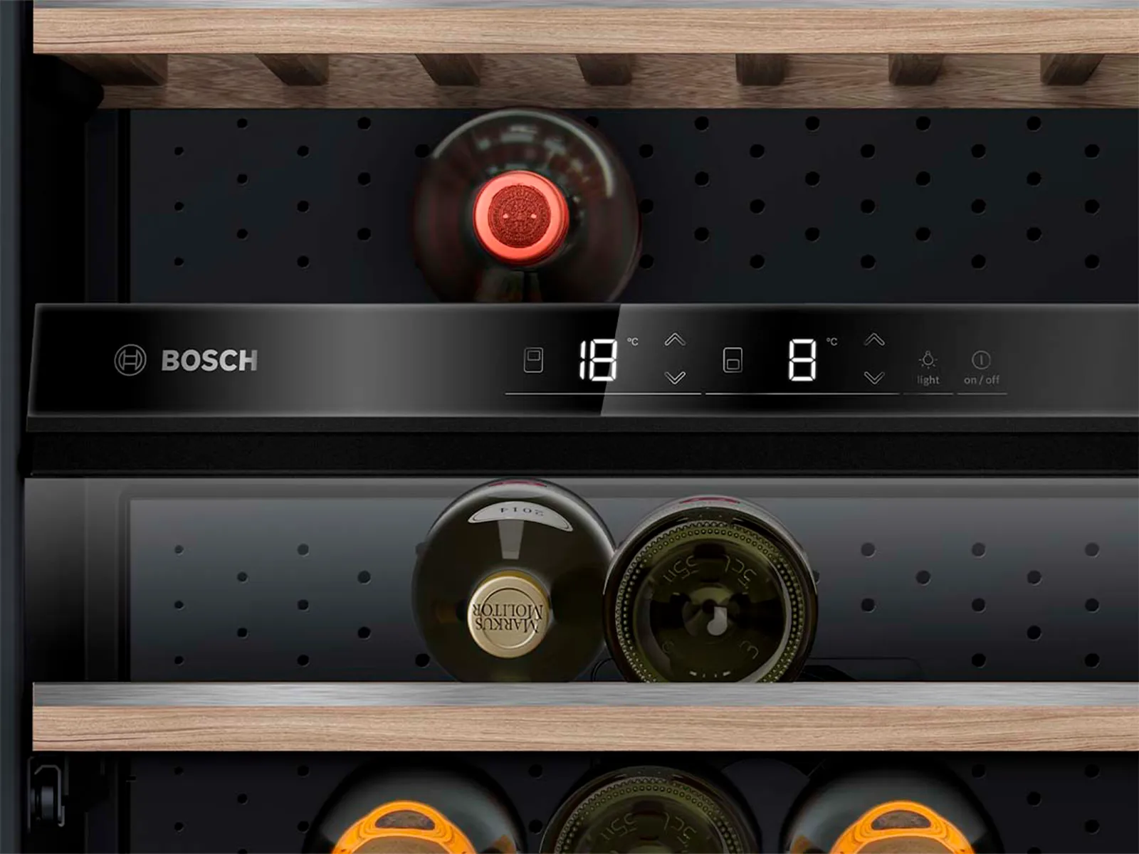 Digital control panel of a wine cabinet with two temperature zones: red wine on the top, white wine on the lower shelves.