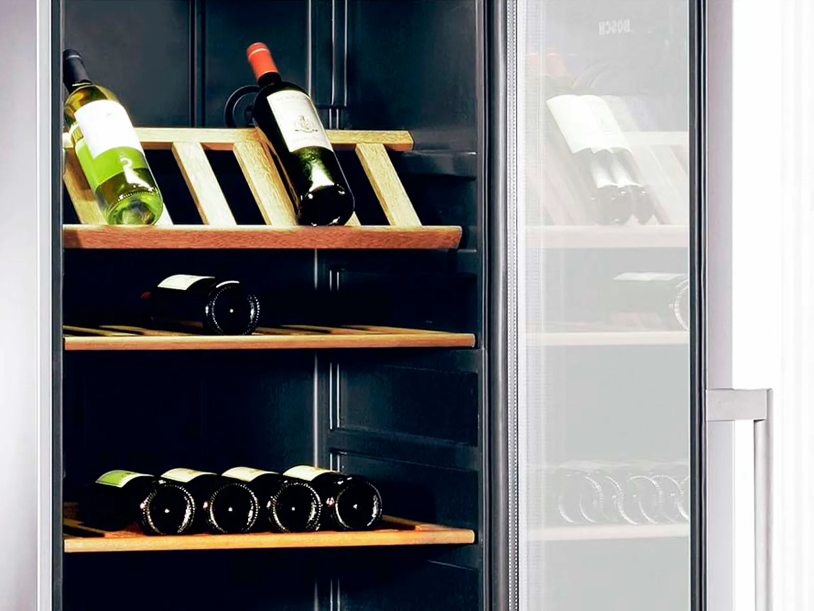 Wine cabinet with an open glas door showing three wooden shelves with wine bottles on them.