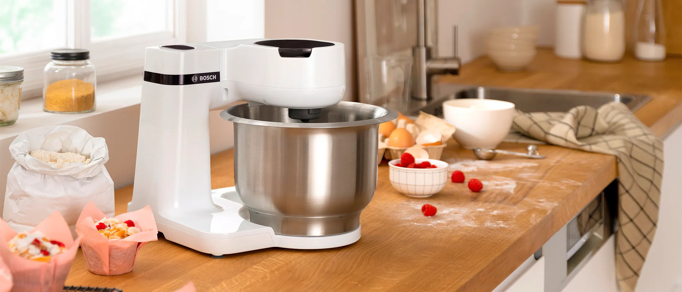 Side view of white Series 2, surrounded by baked goods.