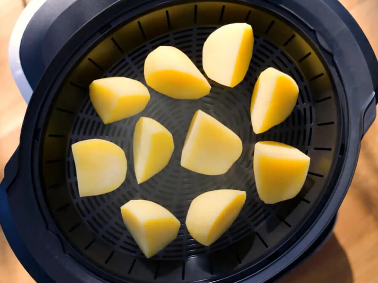 Top view of a cookit in which potatoes are steamed.