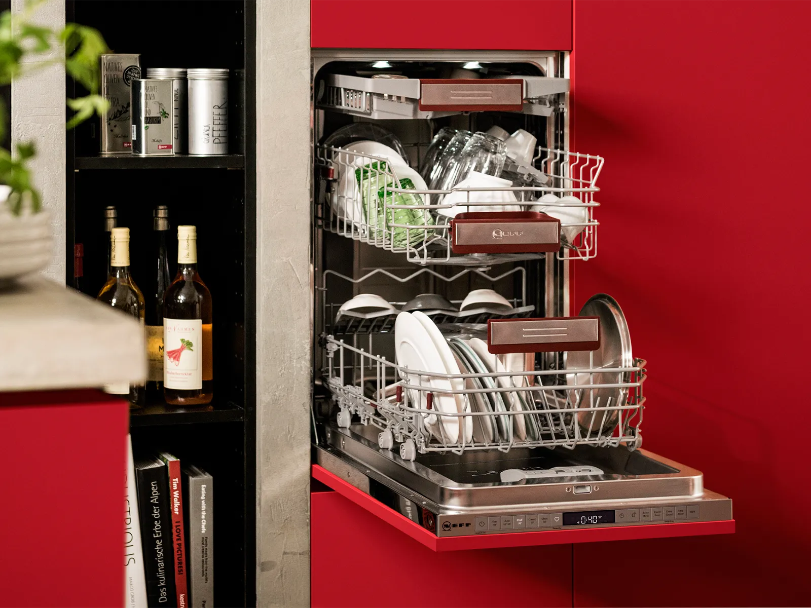 A 45 cm dishwasher fully-integrated at a convenient working height with an open door