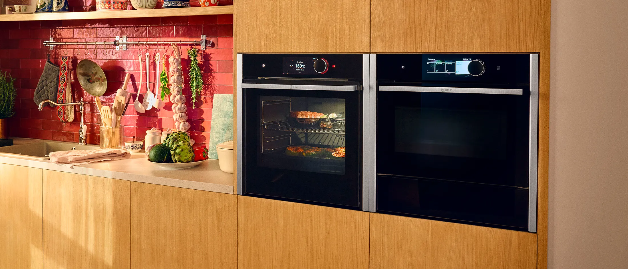  Two integrated ovens with Warming Drawers beside each other in high kitchen cupboards