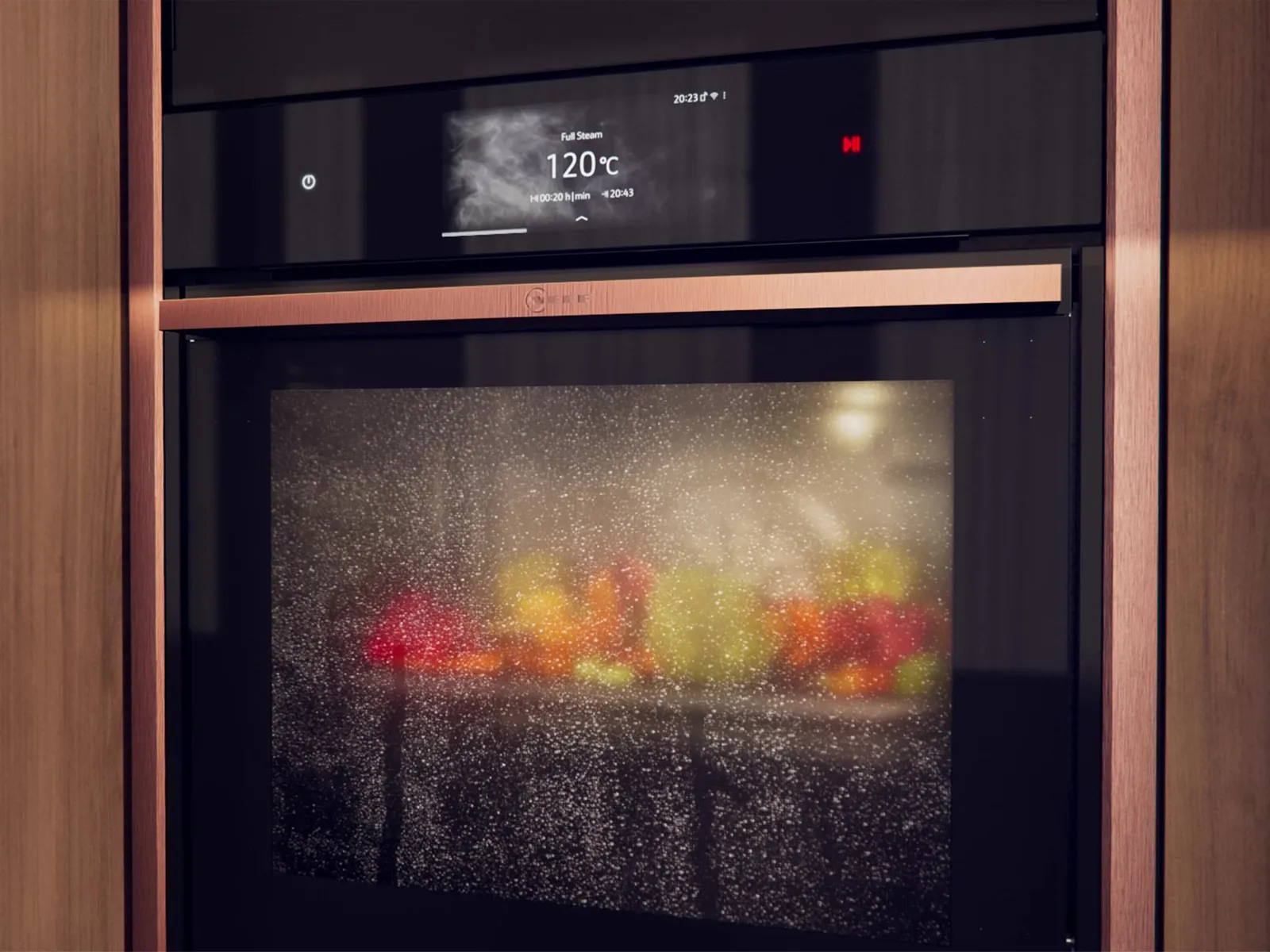 En NEFF dampovn indbygget i et moderne køkken, hvor en perfekt dampet ret netop er blevet tilberedt