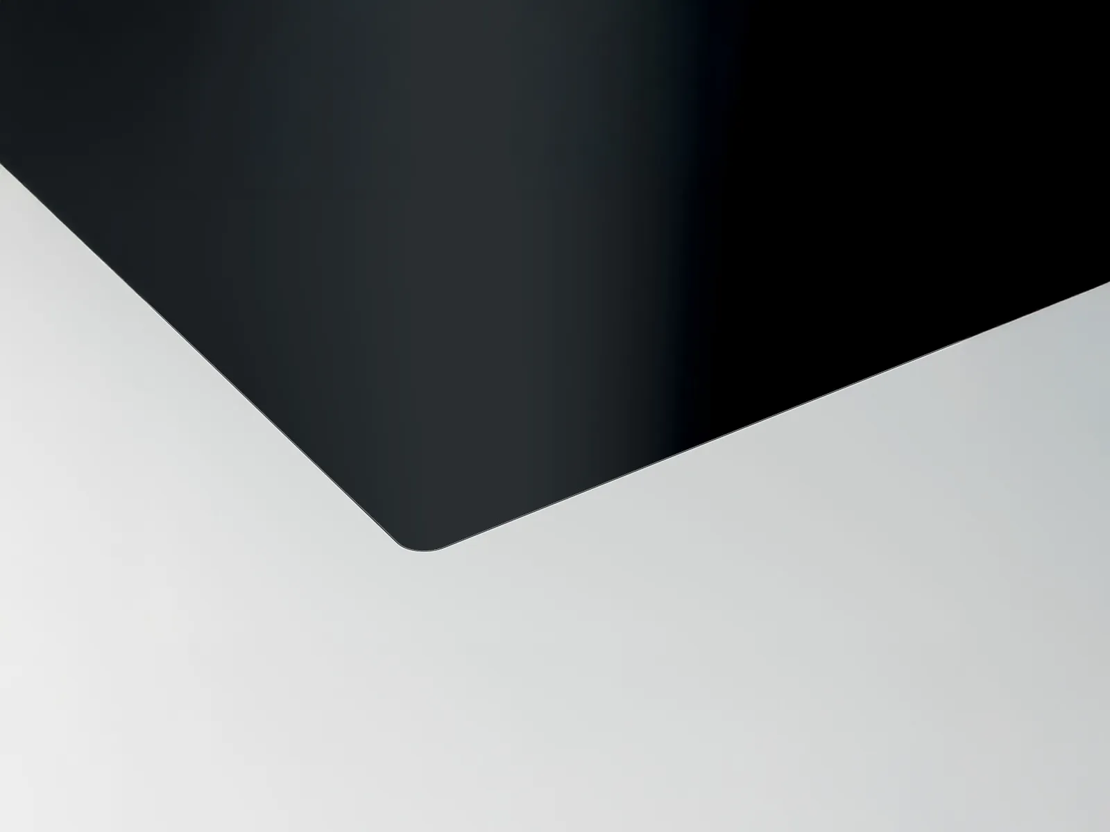 Corner shot of flush-mounted frameless cooktop