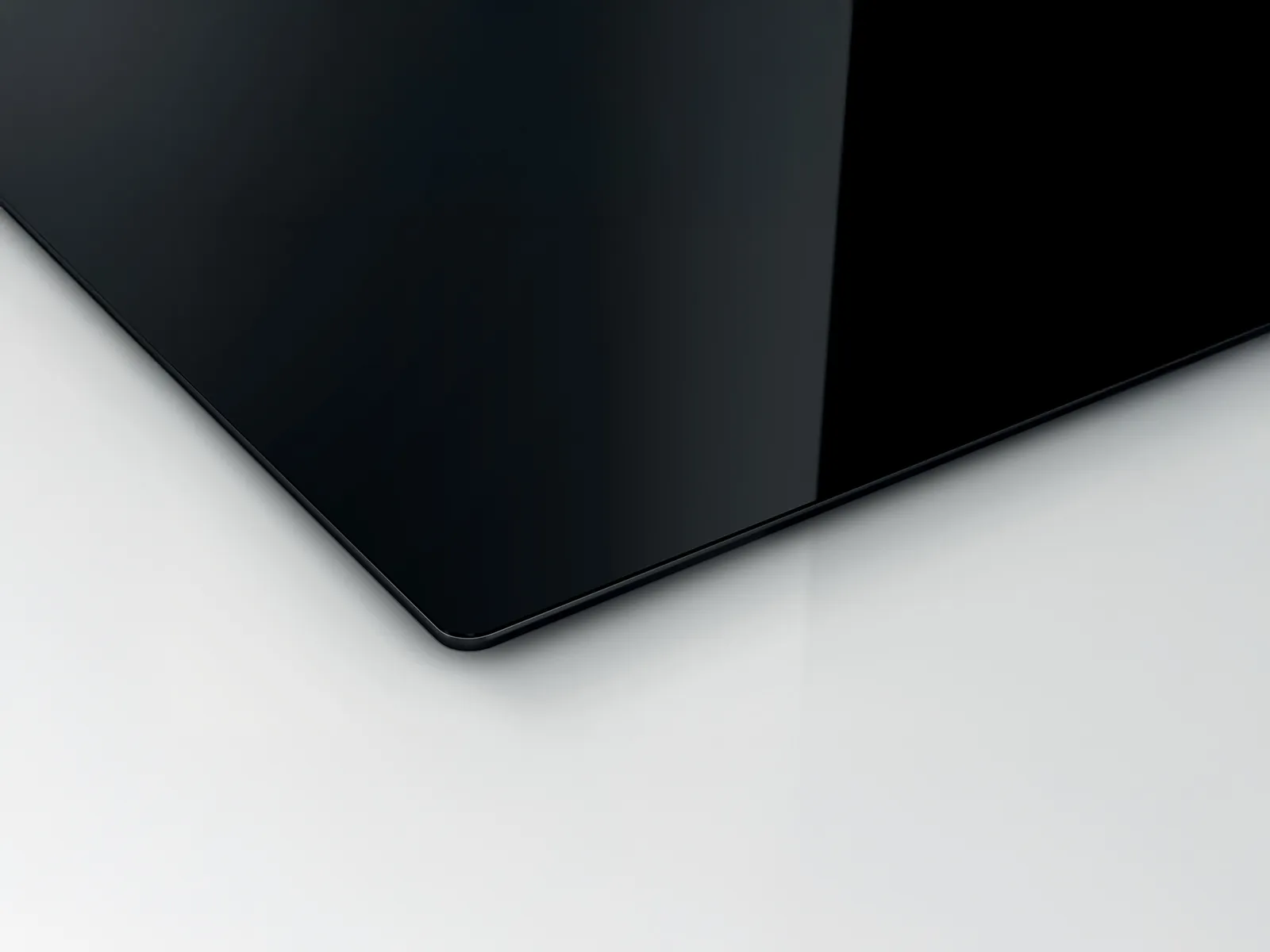 Corner shot of cooktop with black trim