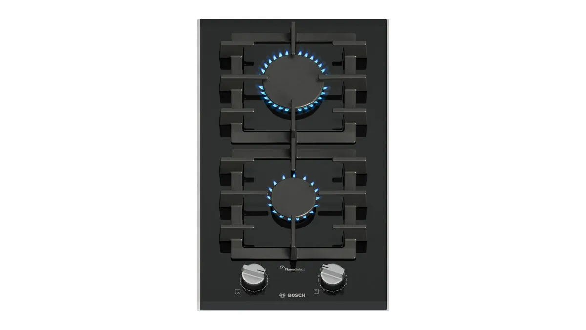 Black gas cooktop with two burners and knobs for temperature control.
