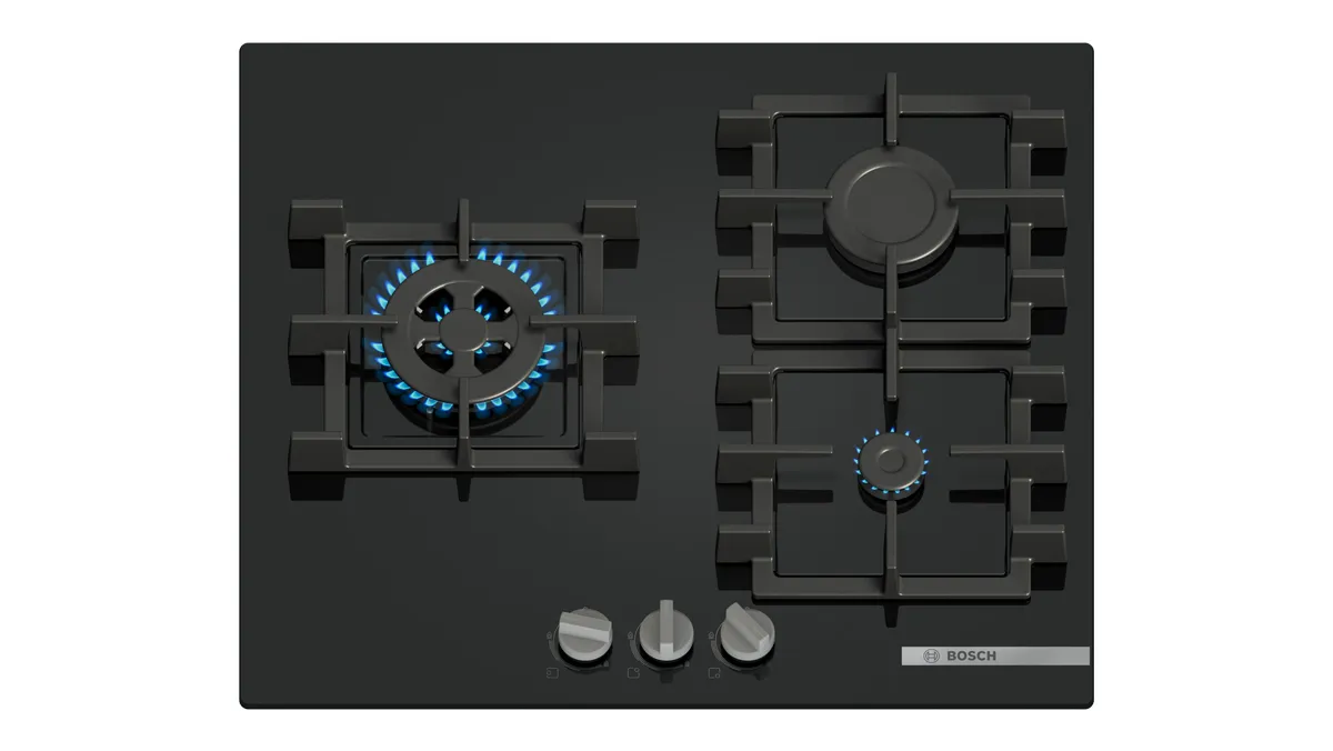 A black gas cooktop with three burners and three control knobs below for temperature adjustment.