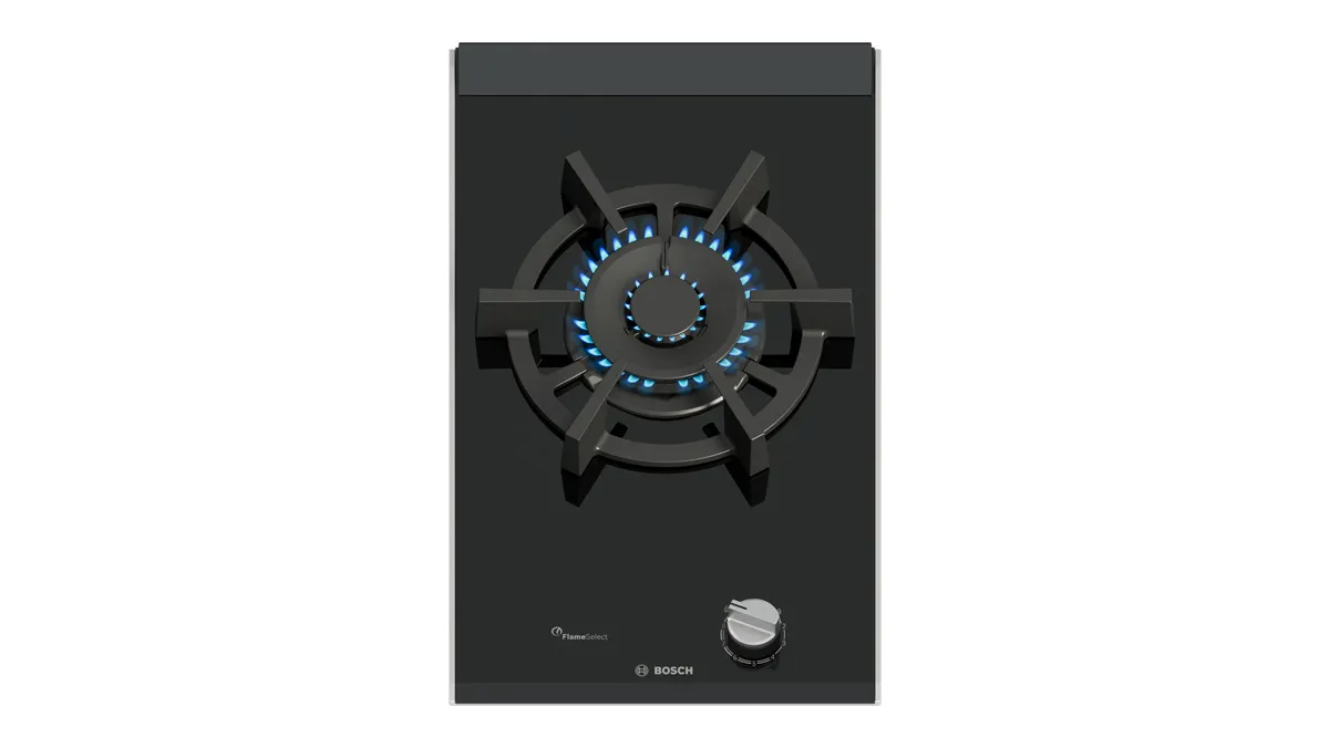 Black gas stove top with a blue flame, a central burner and a control knob.