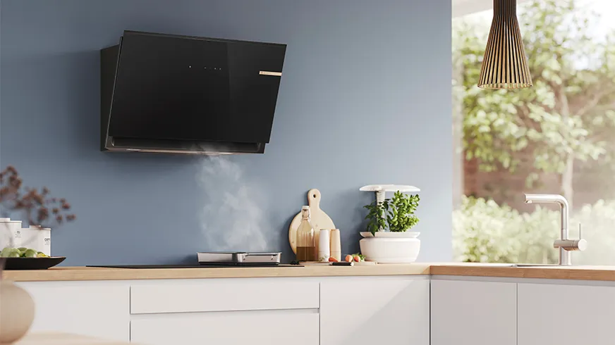 Wall mounted hood in bright kitchen with Bosch appliances